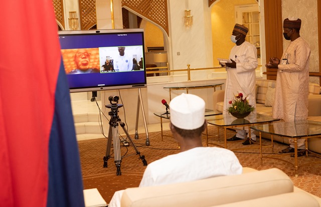 Buhari chatting with Eaagles ahead of their clash with Tunisia.