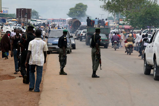 Policemen at a checkpoint.