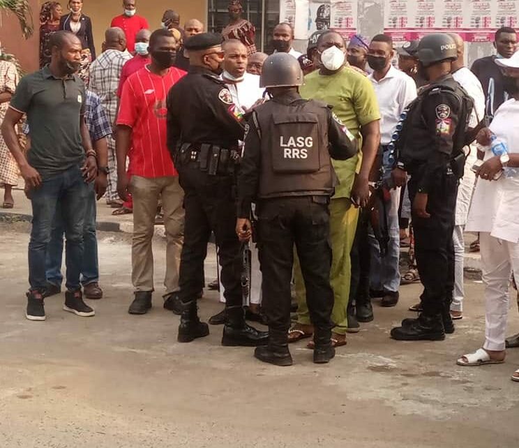 RRS Commander, Egbeyemi while arresting Kunle Poly (in light green wear) on Monday