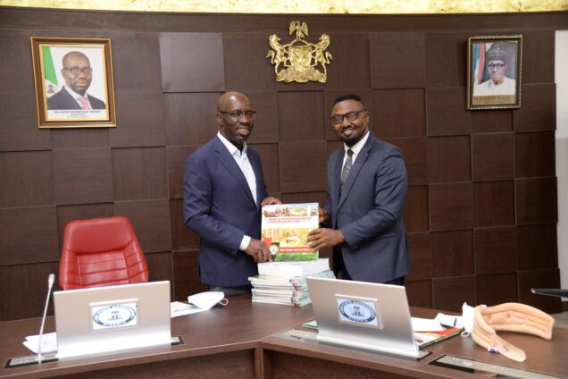 Anthony Okungbowa (right) presenting the Committee’s report to Governor Godwin Obaseki of Edo State