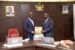 Anthony Okungbowa (right) presenting the Committee’s report to Governor Godwin Obaseki of Edo State