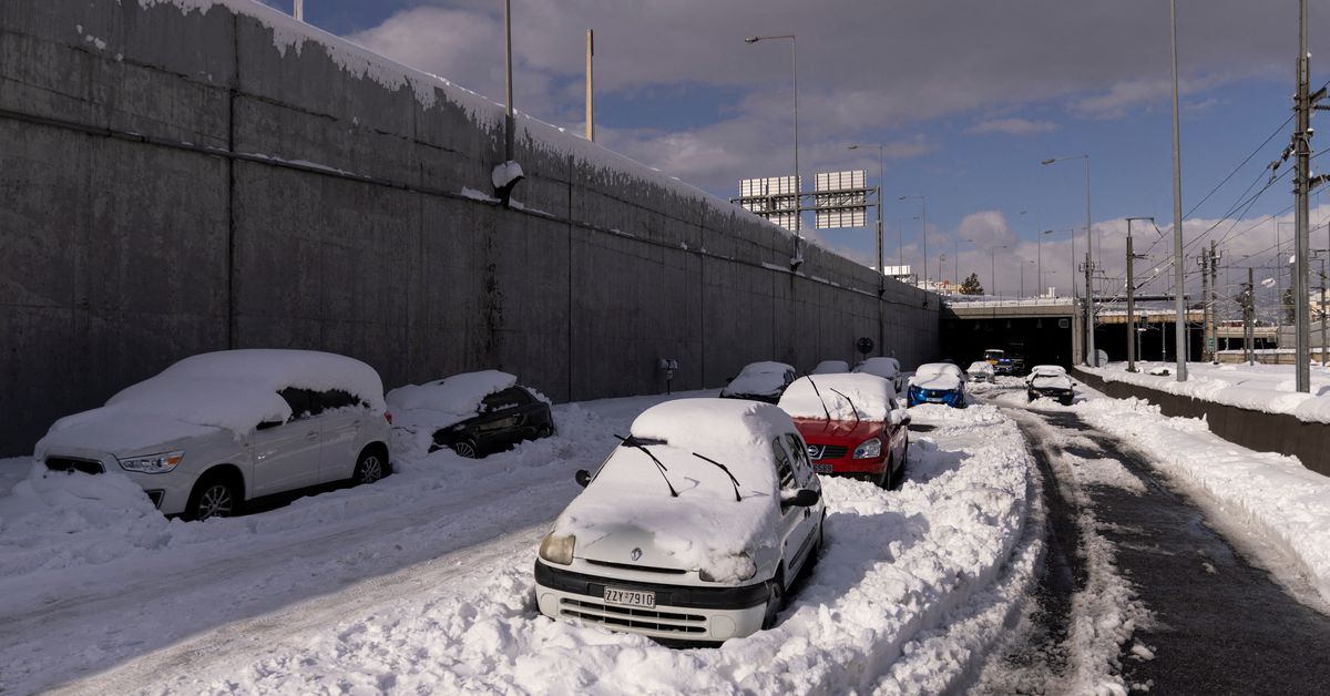 Cars abandoned in snow on the Attiki Odos motorway, following heavy snowfall in Athens, Greece, January 25, 2022. REUTERS/Alkis Konstantinidis