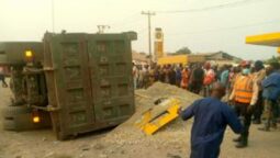 Scene of the accident showing the truck which fell on commercial bus at Toll Gate on Lagos-Abeokuta Expressway on Sunday evening