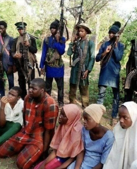 Photo showing some of the abducted students of the Federal Government College, Birnin Yauri and the gunmen who kidnapped them
