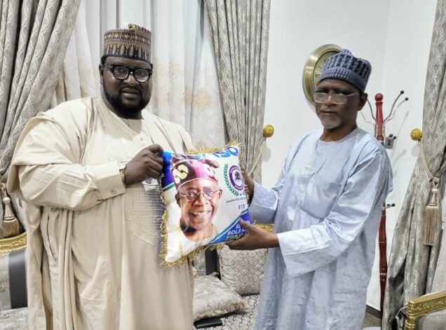Aminu Suleiman DG of Tinubu Support Group presents a branded gift to Adamu