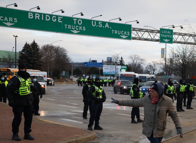 Canadian police at the Ambassador Bridge to liberate it from protesters