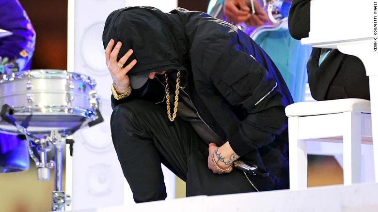 Eminem takes a knee during his Super Bowl halftime performance