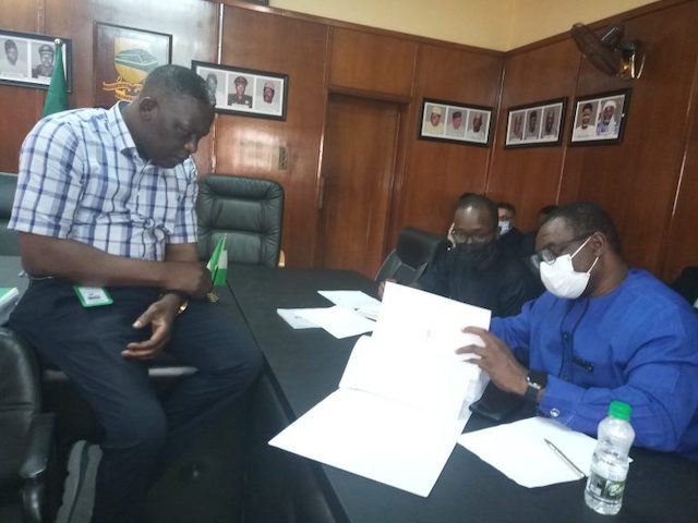 Officials of the NRC and ICRC check the bids submitted for the e-ticketing