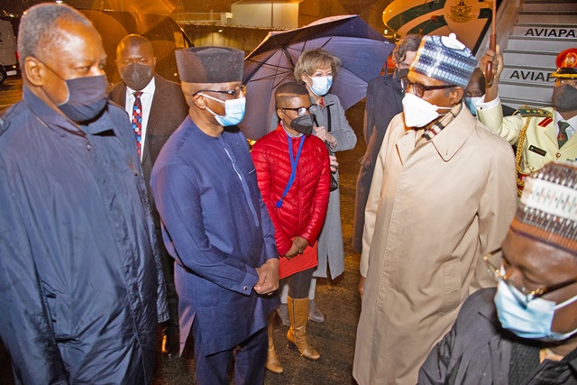 Buhari with Nigerian delegates on arrival in Brussels