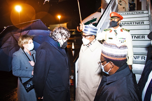 Buhari with Belgian host on arrival in Brussels