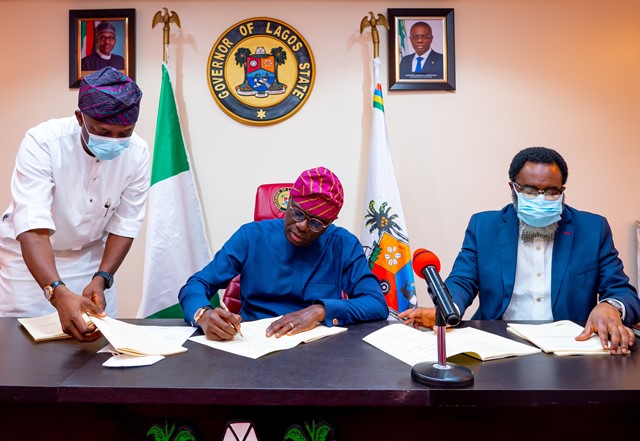 Lagos State Governor, Mr. Babajide Sanwo-Olu signing bills establishing the Lagos State Polytechnic (LASPOTECH), Adeniran Ogunsanya College of Education (AOCOED) and Michael Otedola College of Primary Education (MOCPED) as Universities, flanked by his Special Adviser on Education, Barr. Tokunbo Wahab (left) and the Attorney General/Commissioner for Justice, Mr. Moyosore Onigbanjo, SAN, at the Lagos House, Marina, on Wednesday