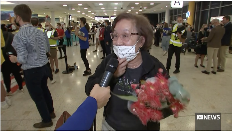 One of the passengers at Sydney Airport on Monday as Australia reopens borders