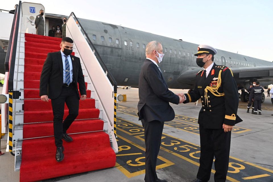 Israeli Defence Minister Benny Gantz is greeted by a Bahrain military official during an official visit, at Bahrain International Airport, Bahrain, February 2, 2022. Elad Malka/Ministry of Defence (MOD)/via REUTERS.