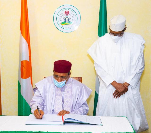 Bazoum signs the visitors' register