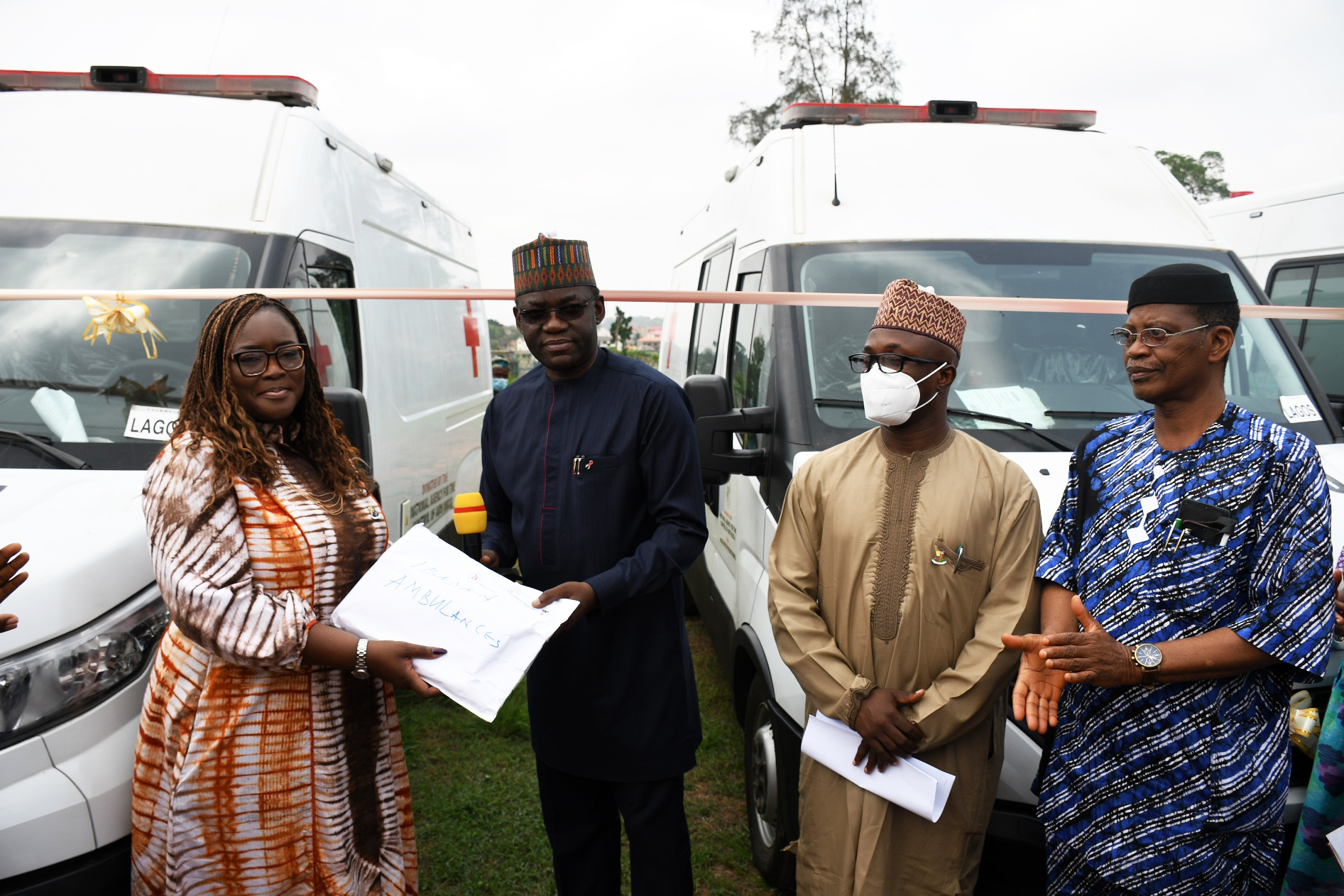 NACA representative hands the ambulances to Adeosun