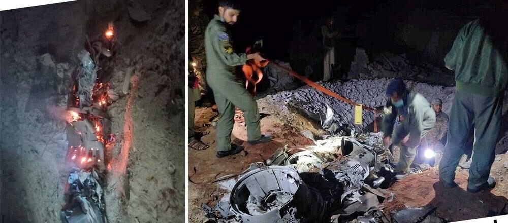 Pakistani Security men clear the Indian missile from landing point