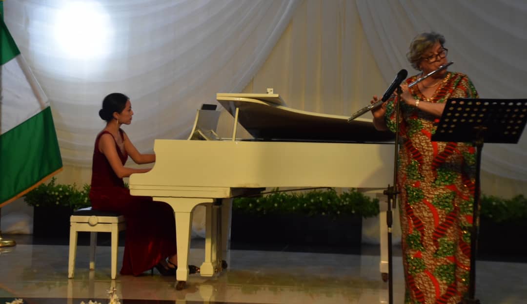 American Classical Pianist, Pauline Yang (L) with US Ambassador, Mary Leonard, on flute at the Musical Performance organised by United States of America Information Department in Ibadan on Sunday Olayinka Bode-Are/NAN