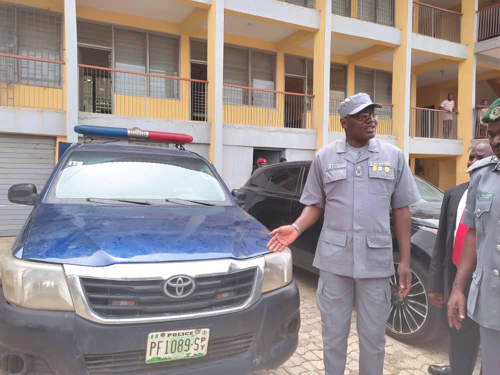 Controller of Ogun Customs command, Bamidele Makinde, parading the Hillux van allegedly owned by the Police used to smuggle rice