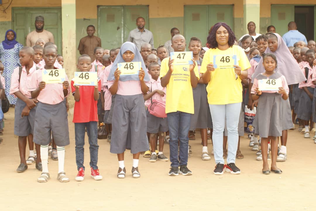 Members of Ugo Edward-Dibiana Down Syndrome Foundation and students during the sensitisation programme
