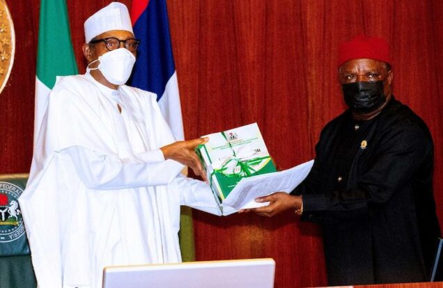 Buhari receives the report of the RMAFC from Engr Elisa Mbam
