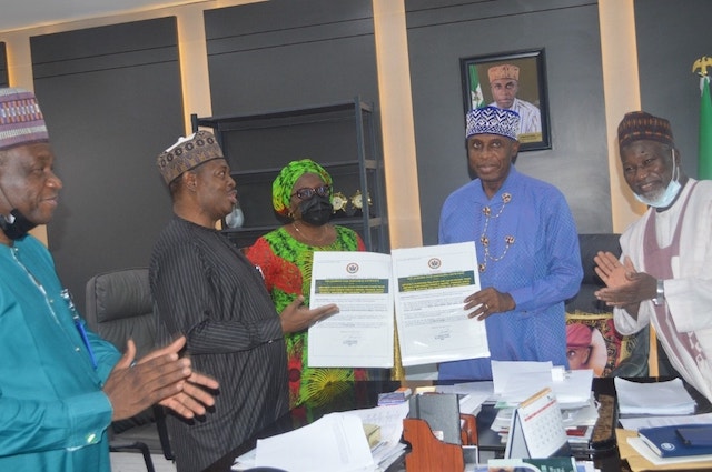 File: ICRC's Michael Ohiani with Minister of Transport Rotimi Amaechi