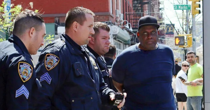 Frank James, the suspect in the mass shooting that occurred on a crowded subway train in Brooklyn, New York on Tuesday with officers of New York City police