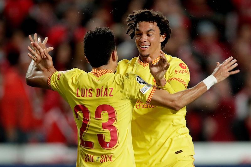 Luis Diaz of Liverpool gets a big hug from Alexander Arnold in Lisbon