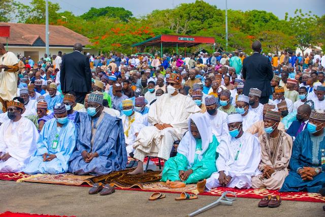 Buhari sits to listen to the Eid sermon
