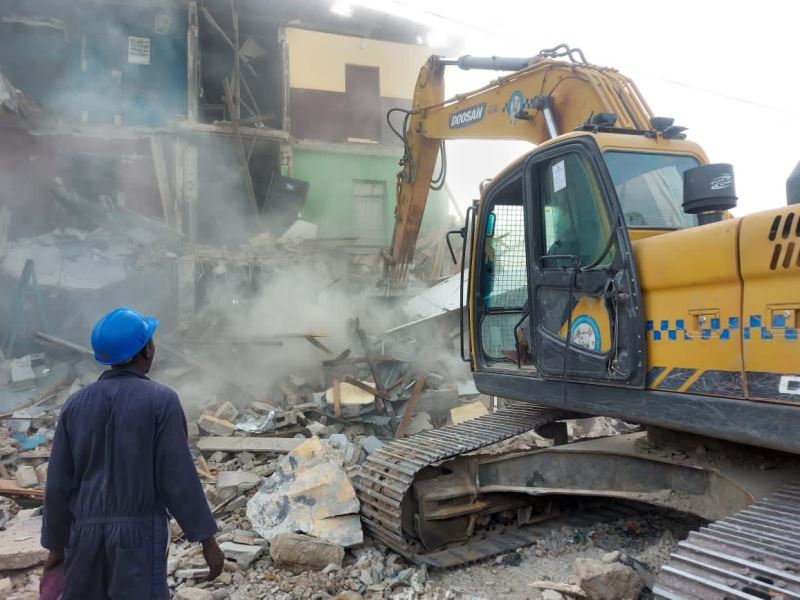 The partially collapsed building pulled down