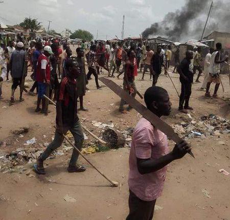 Hoodlums branding dangerous weapons during the clash