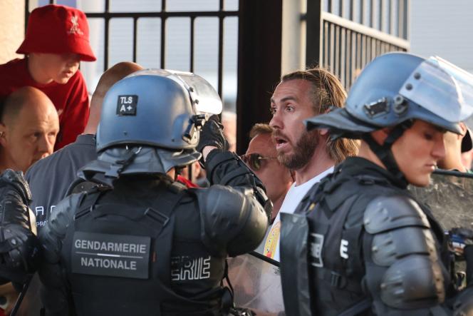 Parisian Police accost fans prior to the UEFA Champions League final football match