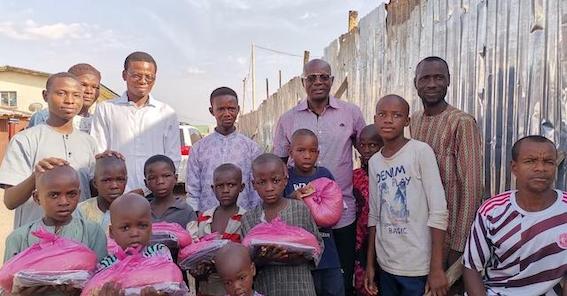 Pastor Yohanna Buru, second right in back row and the orphans