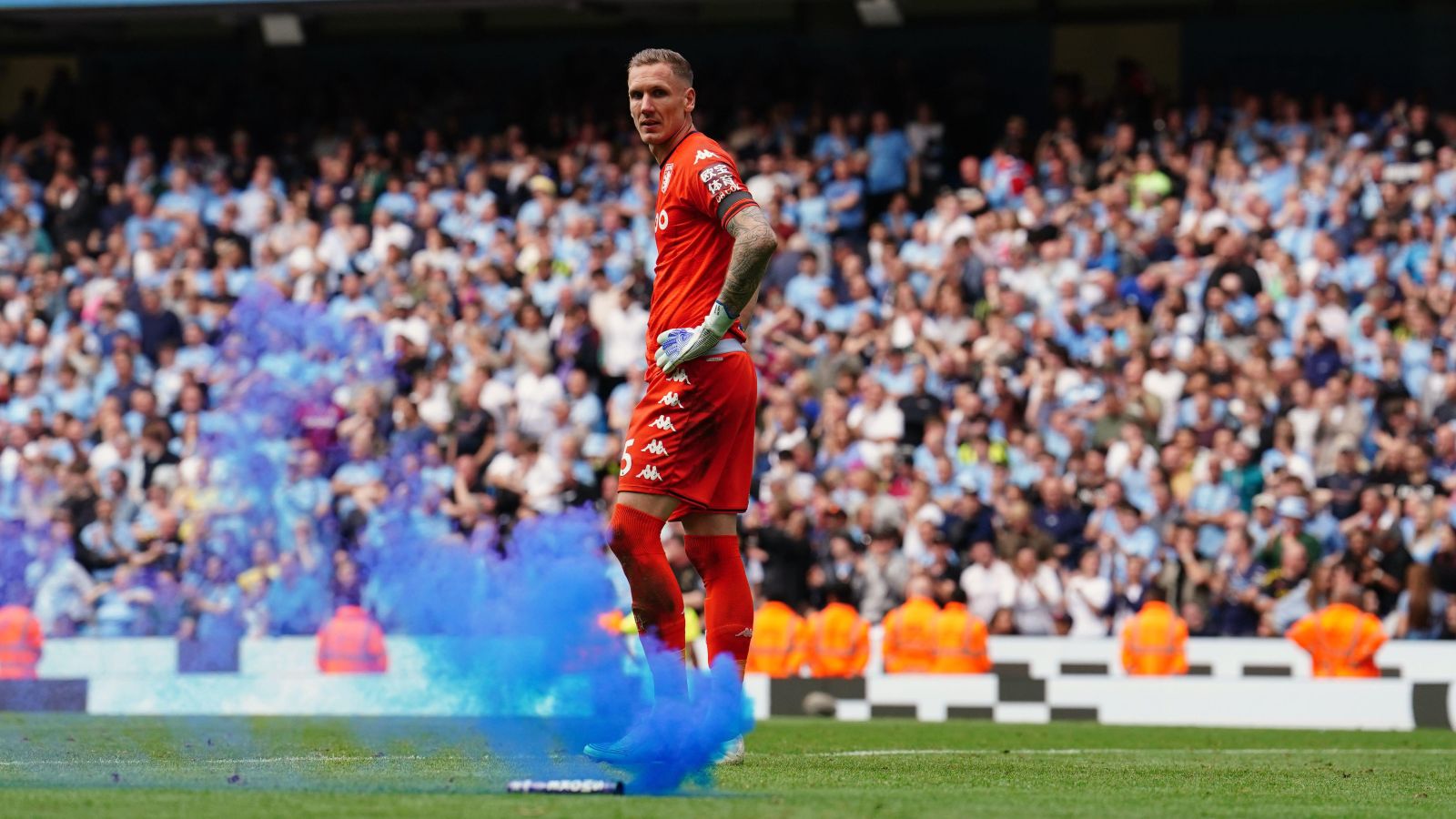 Two fans charged following Etihad pitch invasion after Man City Premier League title win.