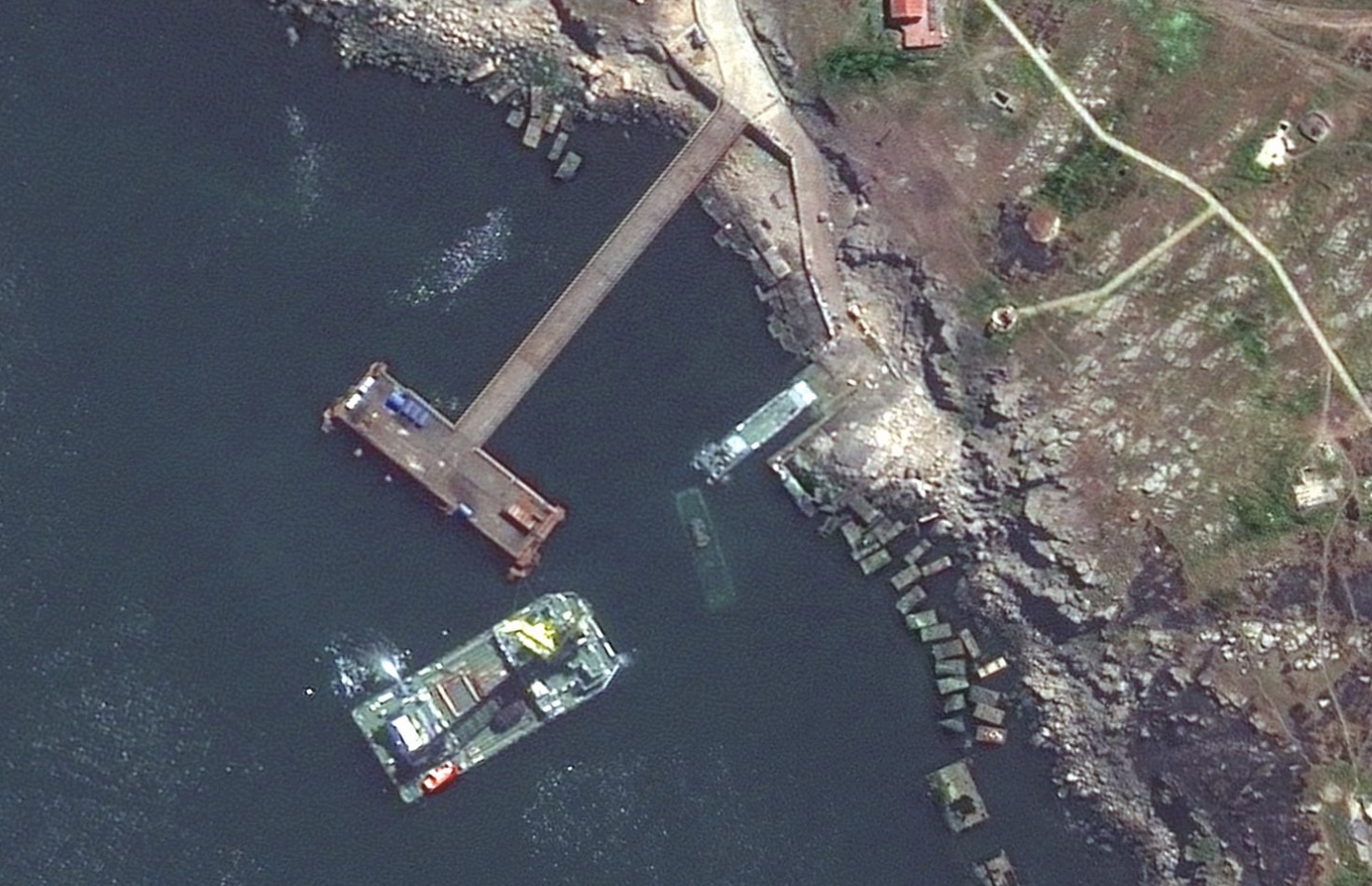 Russia's Serna-class landing craft and a sunken Serna craft in Snake Island