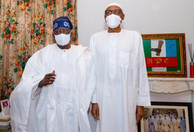 Tinubu and Buhari pose for the camera