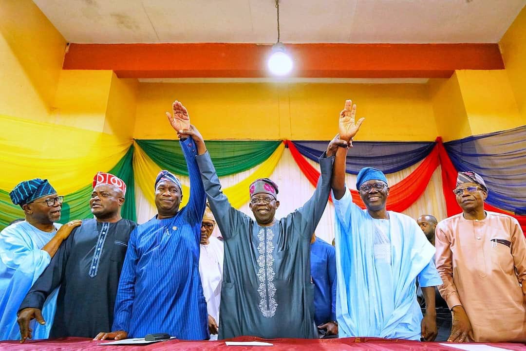 Tinubu raises the hands of Sanwo-Olu and Hamzat for second term in office