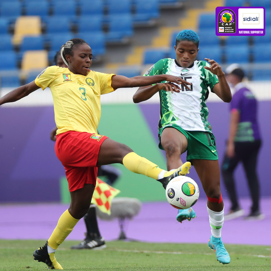 Golden girl, Ajibade fight for the ball with a Cameroonian