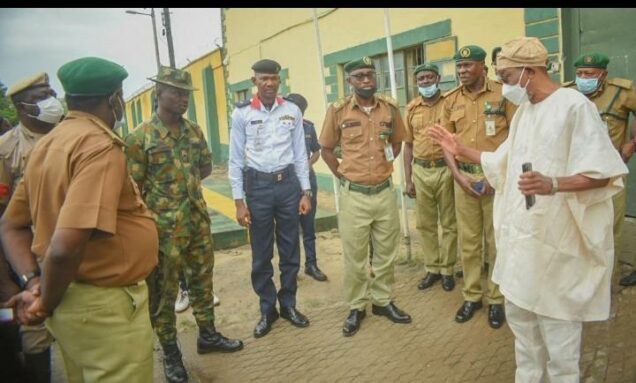 Minister of Interior Rauf Aregbesola speaking to officers during his visit to Kirikiri Custodial Centre on Monday. He revealed to them that over 61,000 arrested Boko Haram terrorists are in various custodial centres in North East Nigeria.