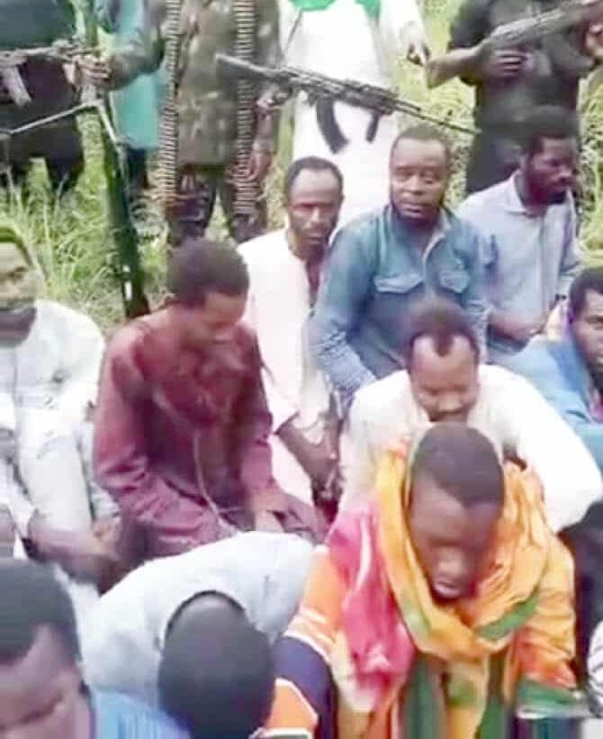 Some of the hostages in captivity and their captors