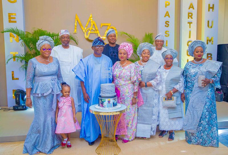 Mr Mike Awoyinfa with his in-laws at the party