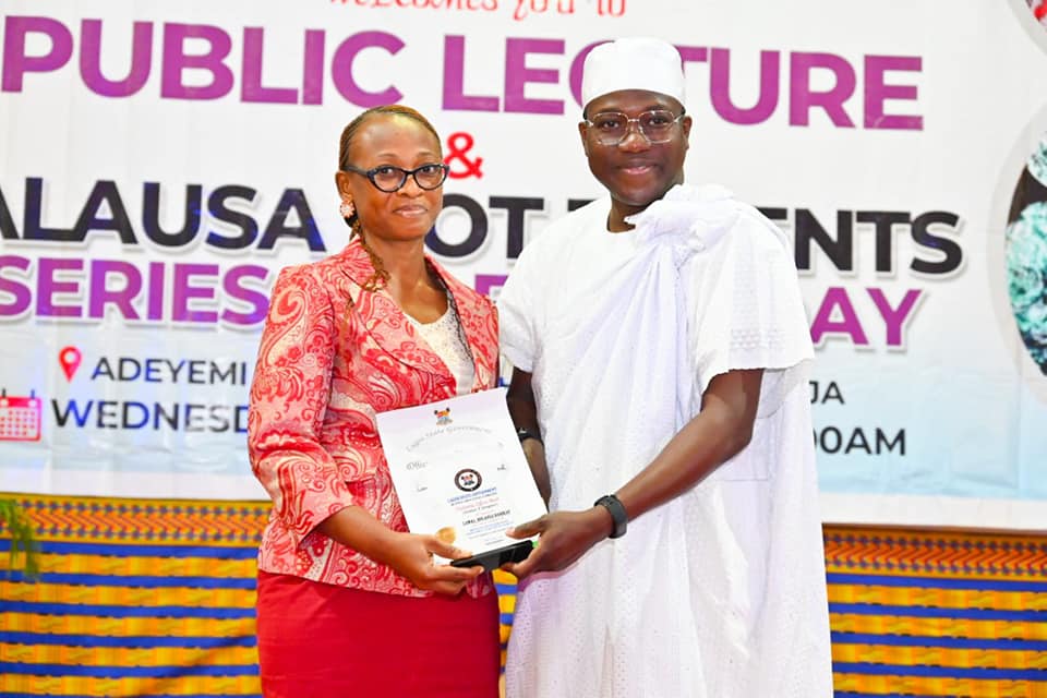 Muri-Okunola presenting award to one of the winners