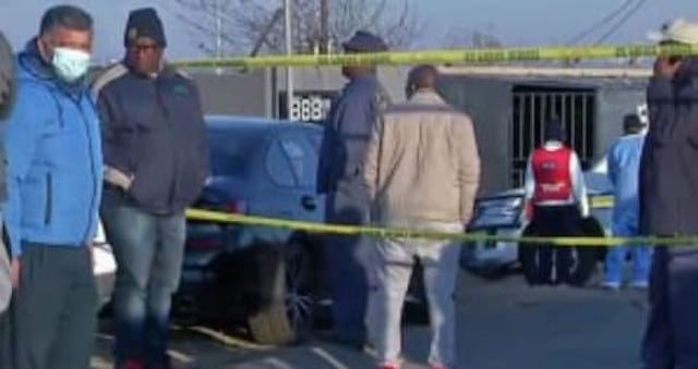 People at the scene of the shooting in Nomzamo Park tavern in Soweto