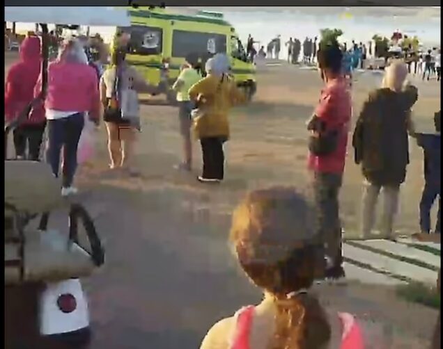 Worried onlookers as the Austrian woman was being taken away in ambulance
