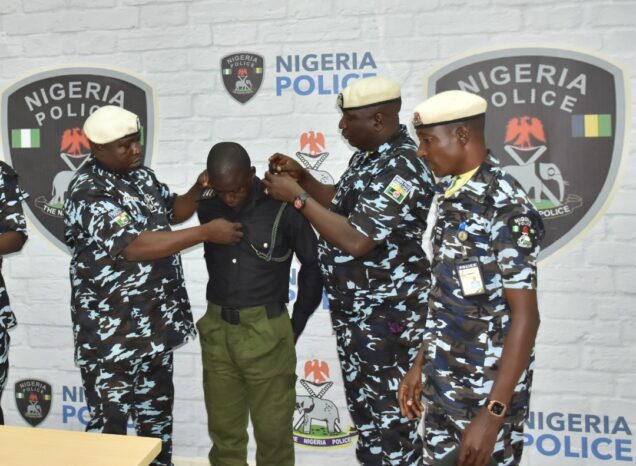 Inspector Richard Gele being de-kitted after he was sacked