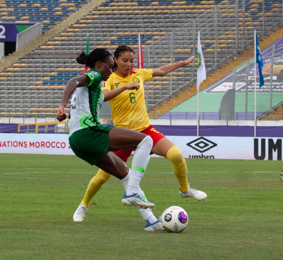Ifeoma Onumonu tangled with a Cameroonian player