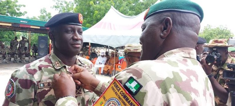 GOC 7 Division, Maj.-Gen. Waidi Shaibu being decorated by Maj. General Khalifa of MNJTF