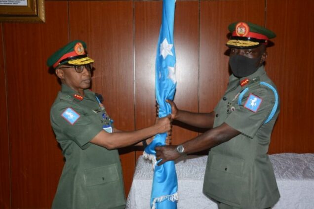(L-R )The Outgone GOC 1 Division Nigeria Army Maj-Gen Kabir Muhktar, presenting symbol of the division Stallion Flag to new GOC Maj-Gen Taoreed Lagbaja