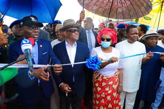 Nyesom Wike, middle, with Governor Sanwo-Olu of Lagos at the commissioning of a bridge in PH