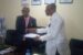Dotimi Tawari presenting a copy of the draft Bill to Edo NUJ Chairman, Festus Alenkhe