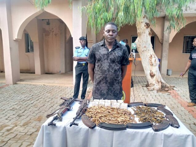 Ex-Army Lance Corporal Sa’idu Lawal  with rifles, a cache of ammunition and magazines he was going to deliver in Gusau, Zamfara